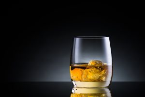 Melting ice in a glass of whiskey